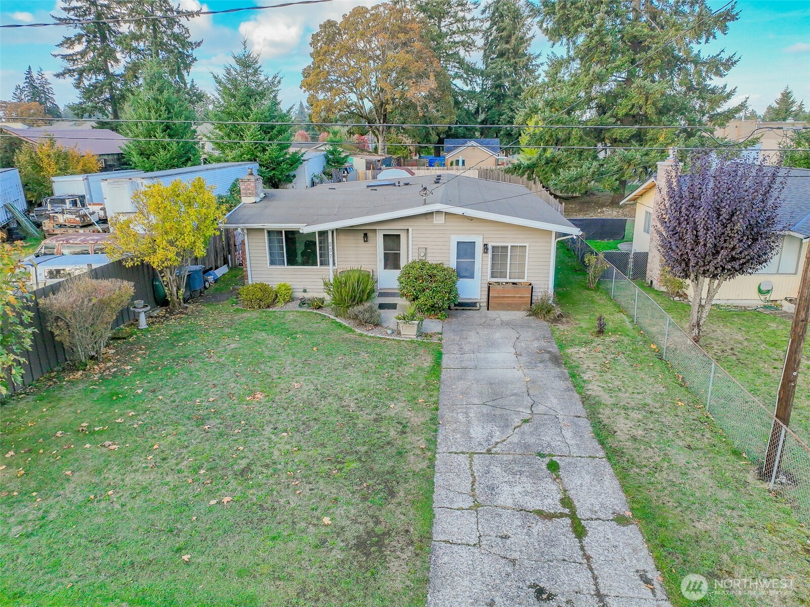 237 167th Street South Spanaway, WA 98387 - Photo 22 of 30 a front view of a house with garden