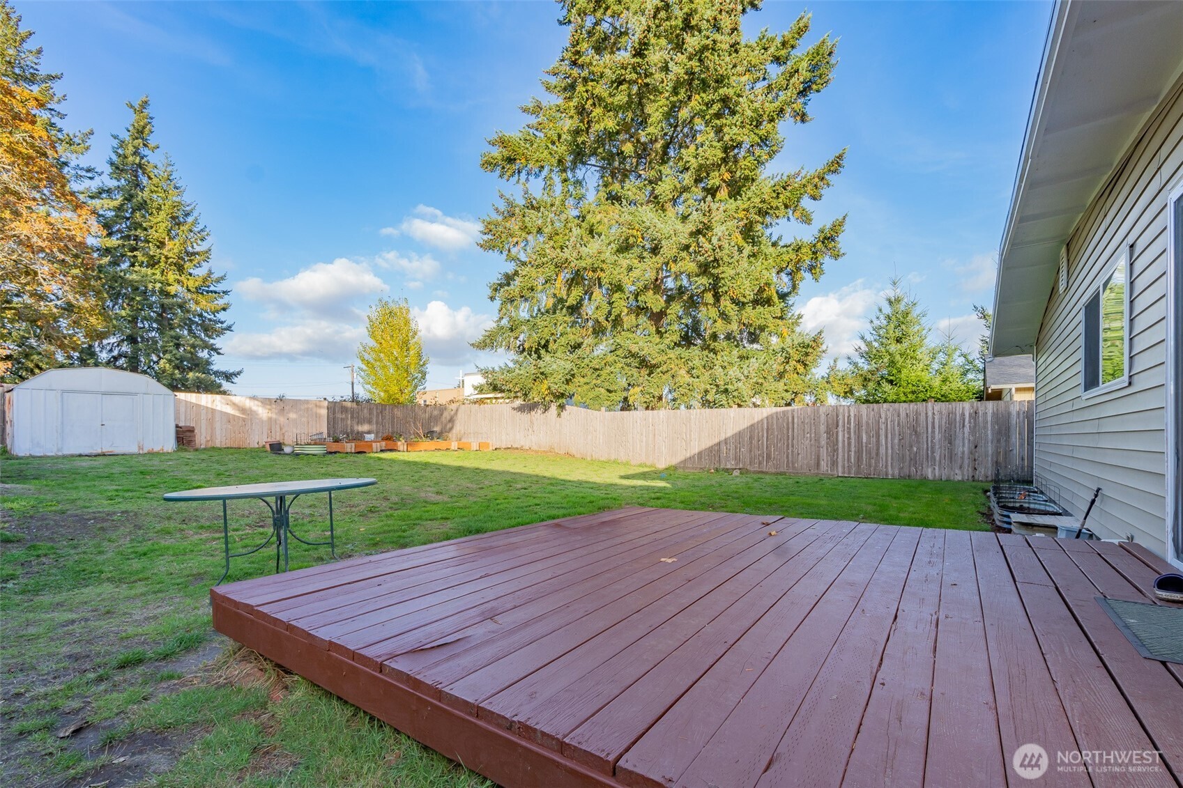 237 167th Street South Spanaway, WA 98387 - Photo 24 of 30 a view of a backyard with a garden