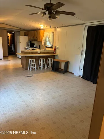 a view of a kitchen with a sink