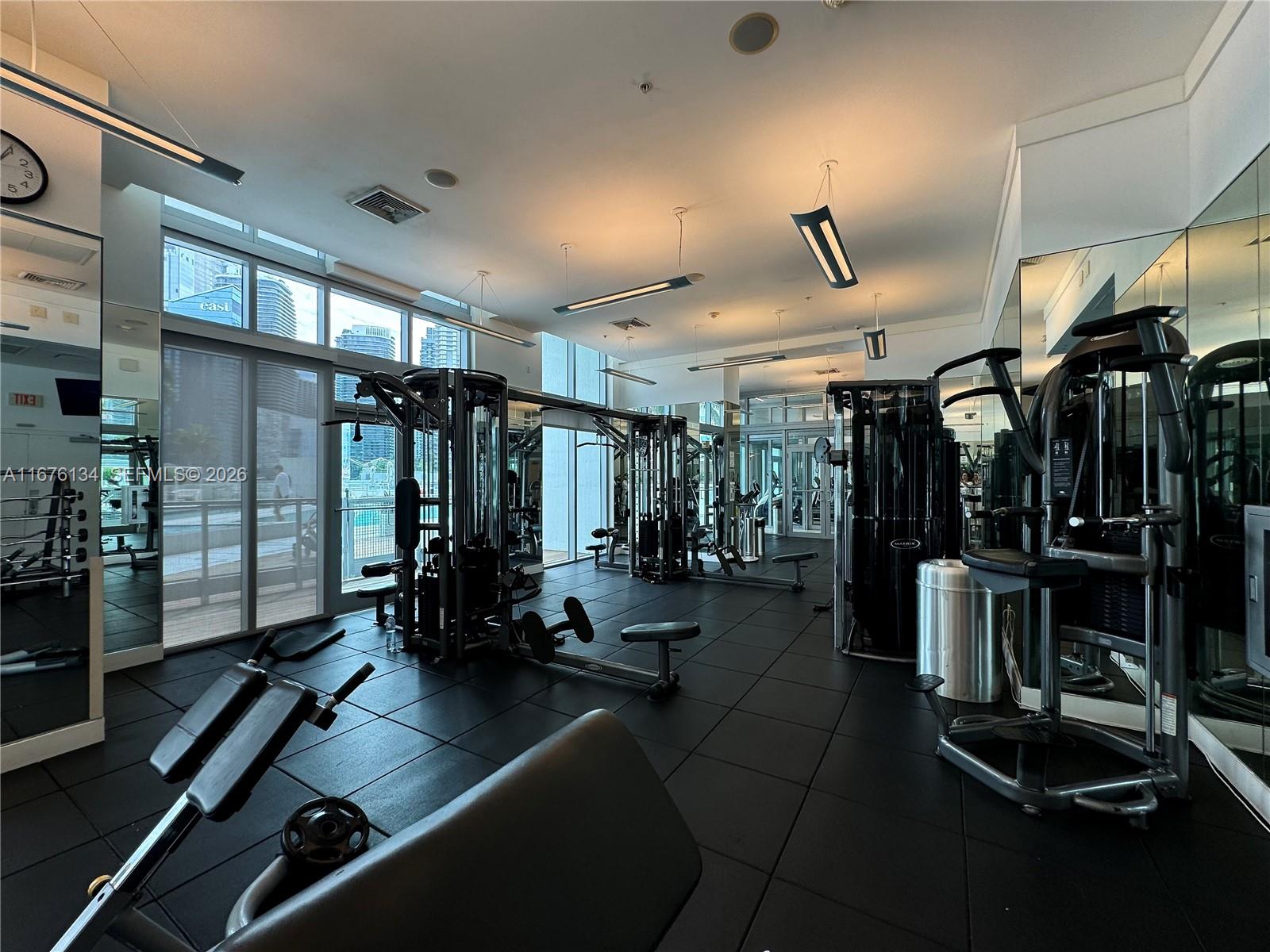 90 Southwest 3rd Street, Unit 3210 Miami, FL 33130 - Photo 18 of 24 a view of a room with gym equipment
