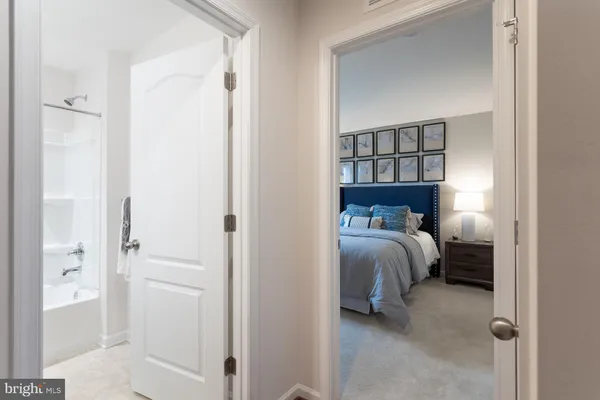 a bed room with a bed and a painting