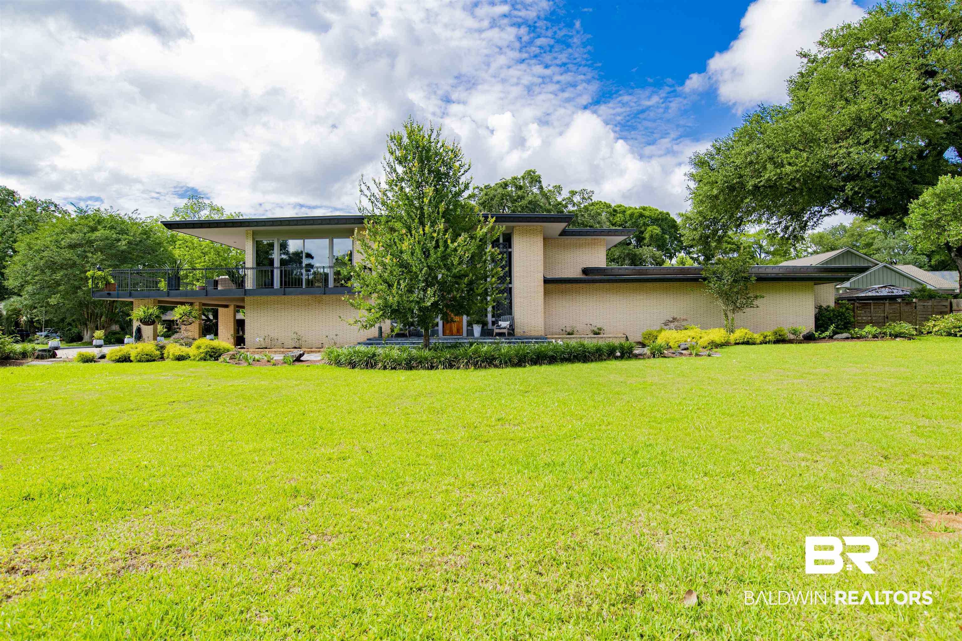 809 Bernard Circle Mobile, AL 36693 - Photo 48 of 75 Mid-century modern residence featuring a light-colored brick facade and expansive front lawn