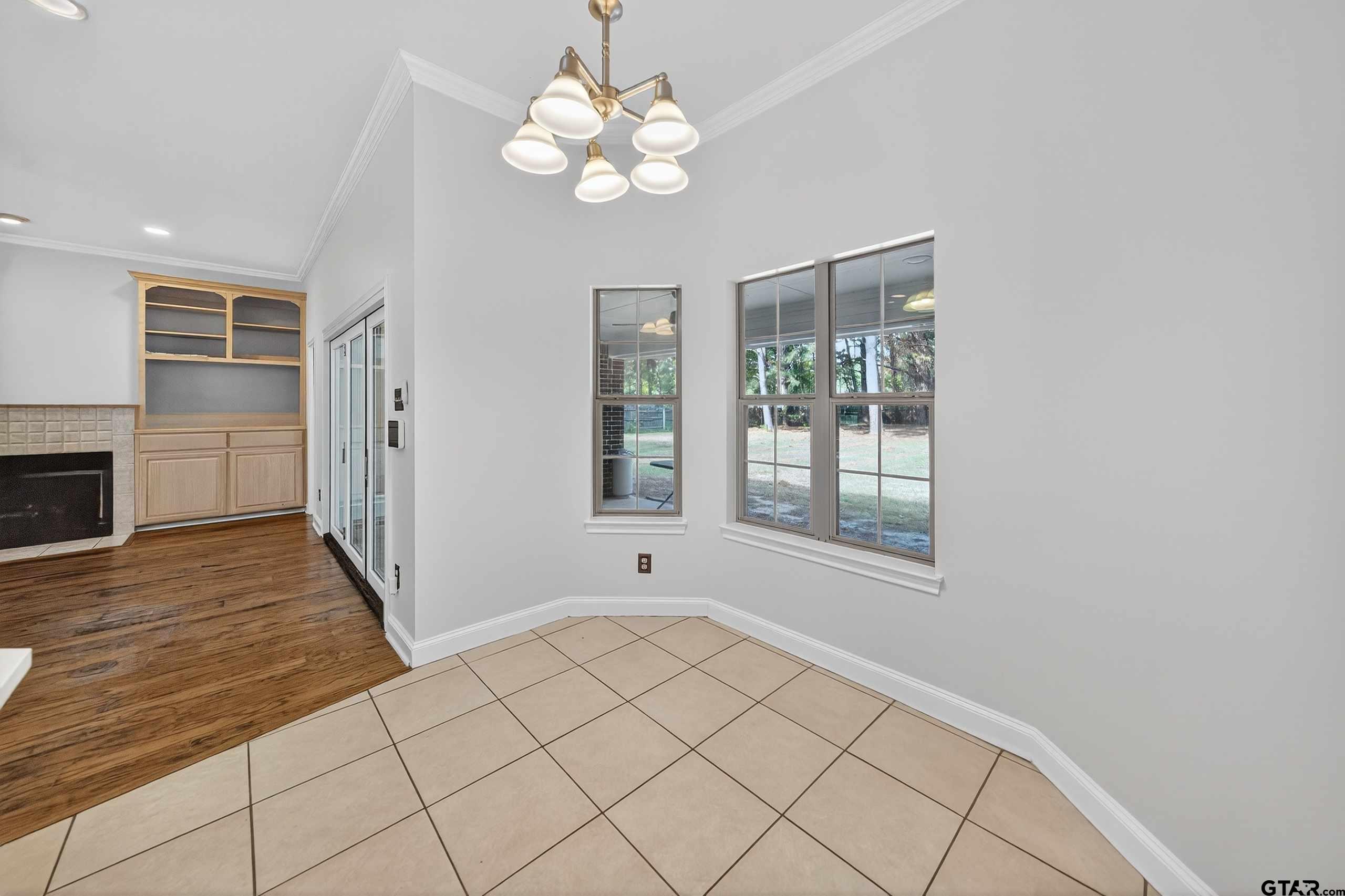 21112 Altuda Lane Flint, TX 75762 - Photo 13 of 48 a view of an empty room with a window and wooden floor
