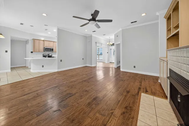 a view of kitchen with cabinets and wooden floor