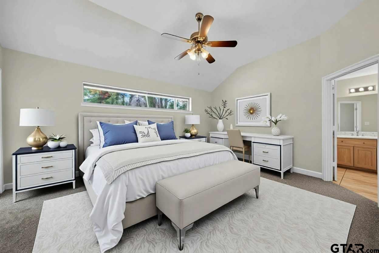 21112 Altuda Lane Flint, TX 75762 - Photo 22 of 48 a spacious bedroom with a bed and a chandelier