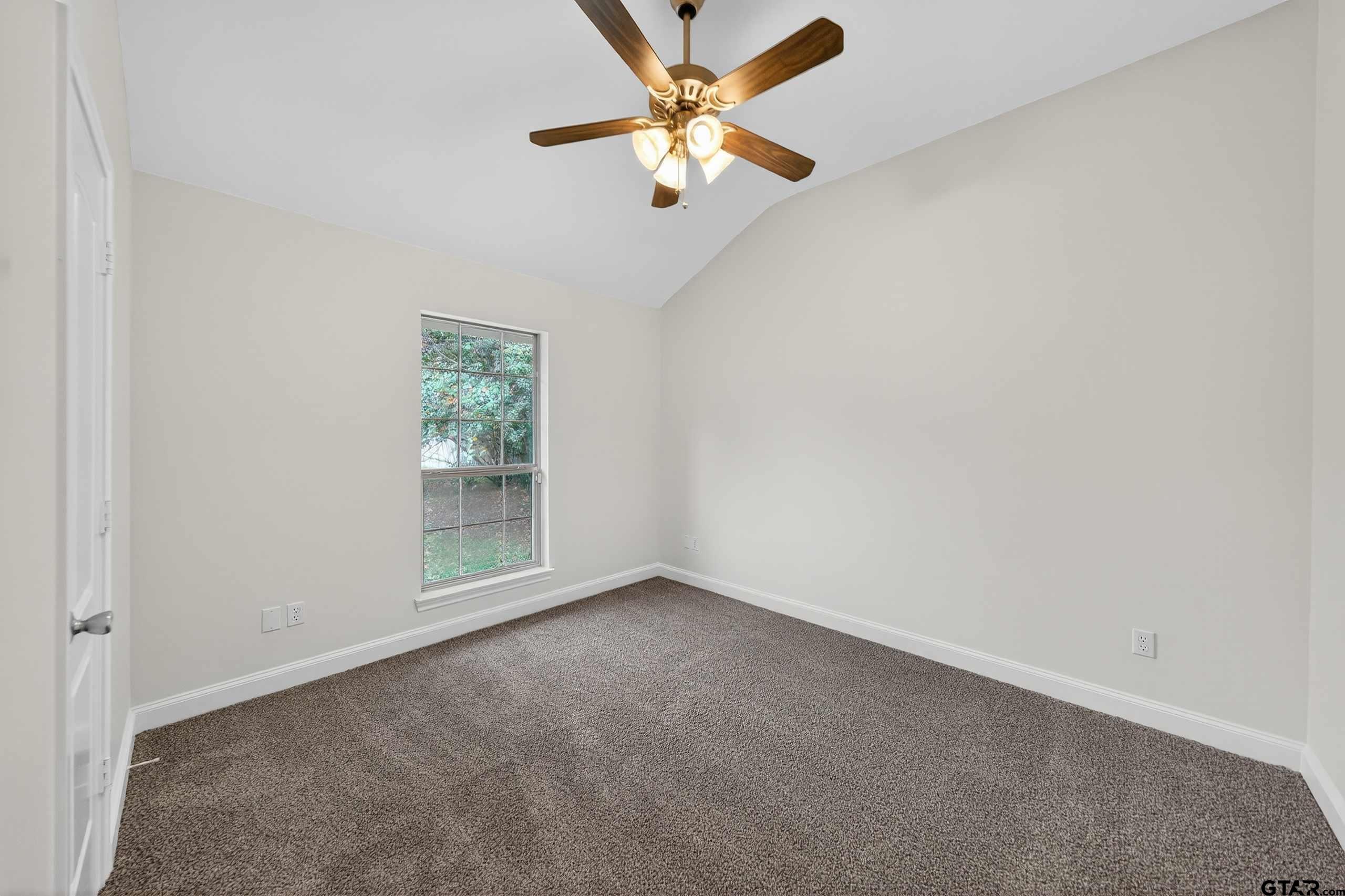 21112 Altuda Lane Flint, TX 75762 - Photo 28 of 48 an empty room with a window and a fan