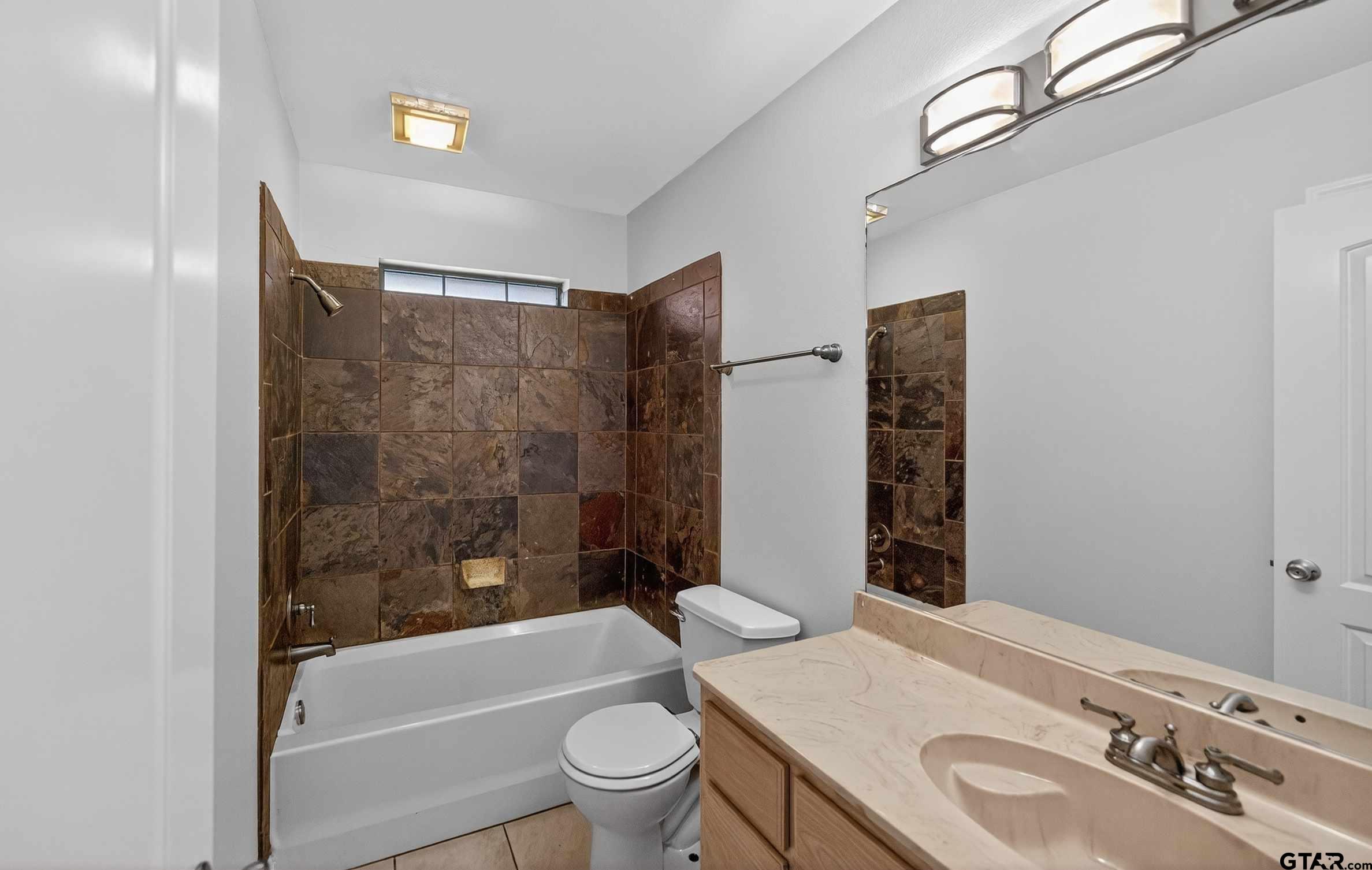 21112 Altuda Lane Flint, TX 75762 - Photo 30 of 48 a bathroom with a sink toilet and shower