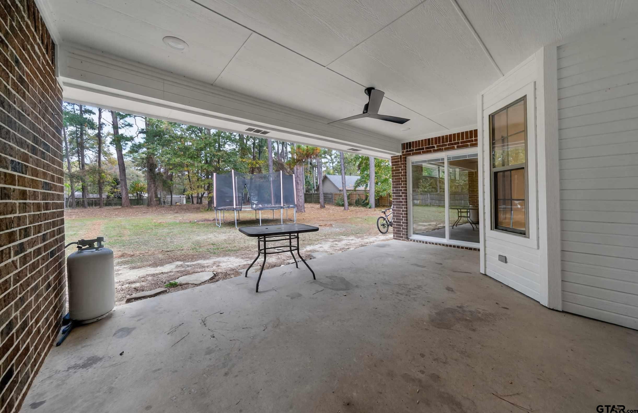 21112 Altuda Lane Flint, TX 75762 - Photo 42 of 48 a view of a porch with furniture and a backyard