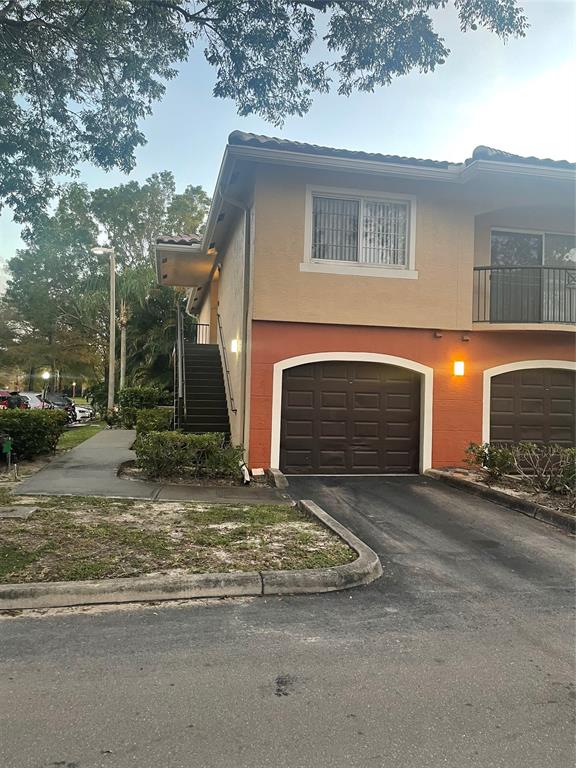 4179 Haverhill Road, Unit 602 West Palm Beach, FL 33417 - Photo 3 of 15 a view of a house with a garage