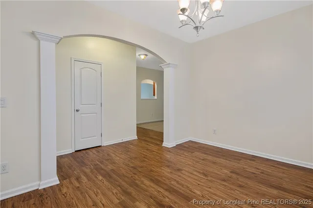 a view of empty room with a fireplace