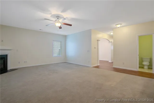 a view of a kitchen with a sink cabinets and a ceiling fan