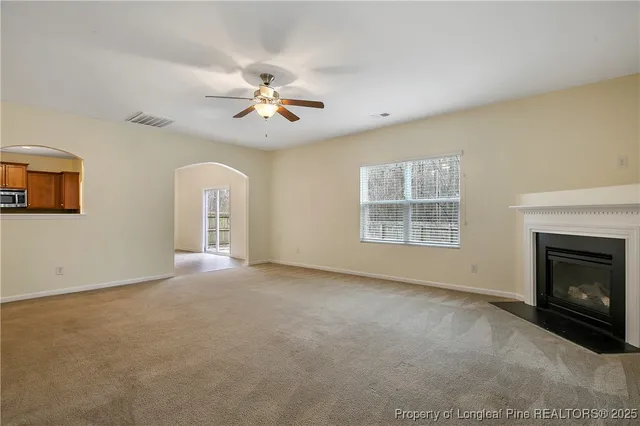 a kitchen with stainless steel appliances granite countertop a sink and wooden cabinets