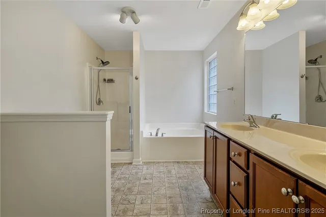 a bathroom with a sink a mirror and a bathtub