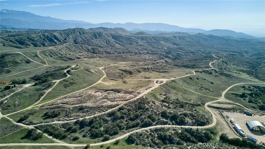 a view of a lush green hillside and a mountain