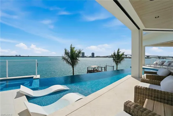 a living room with furniture rug and wooden floor