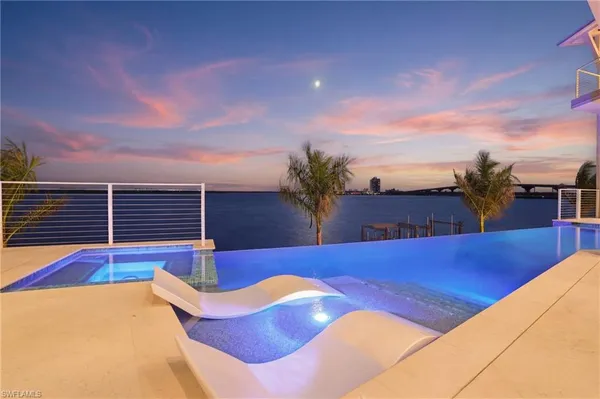 a view of swimming pool with seating space