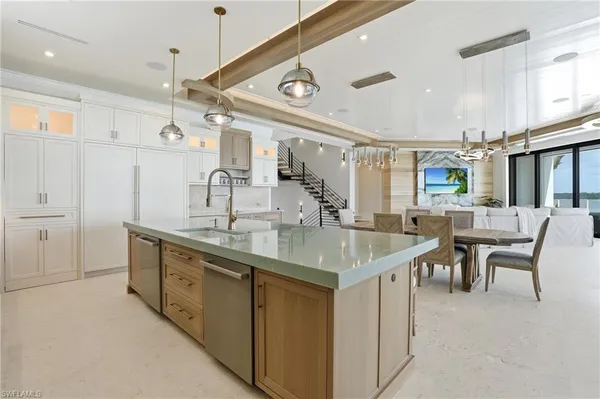 a kitchen with cabinets a sink and appliances