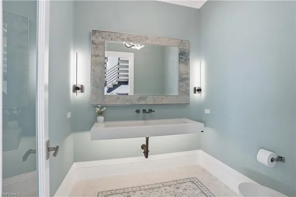 a bathroom with a bathtub and shower