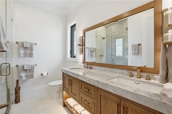 a spacious bathroom with a granite countertop sink and a mirror