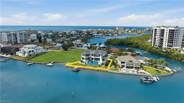 a view of a chairs and table in the patio