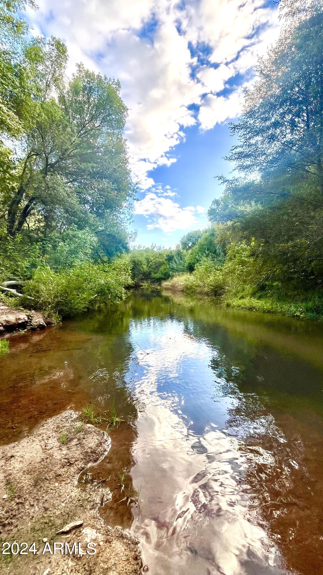 a view of a lake with houses in the background