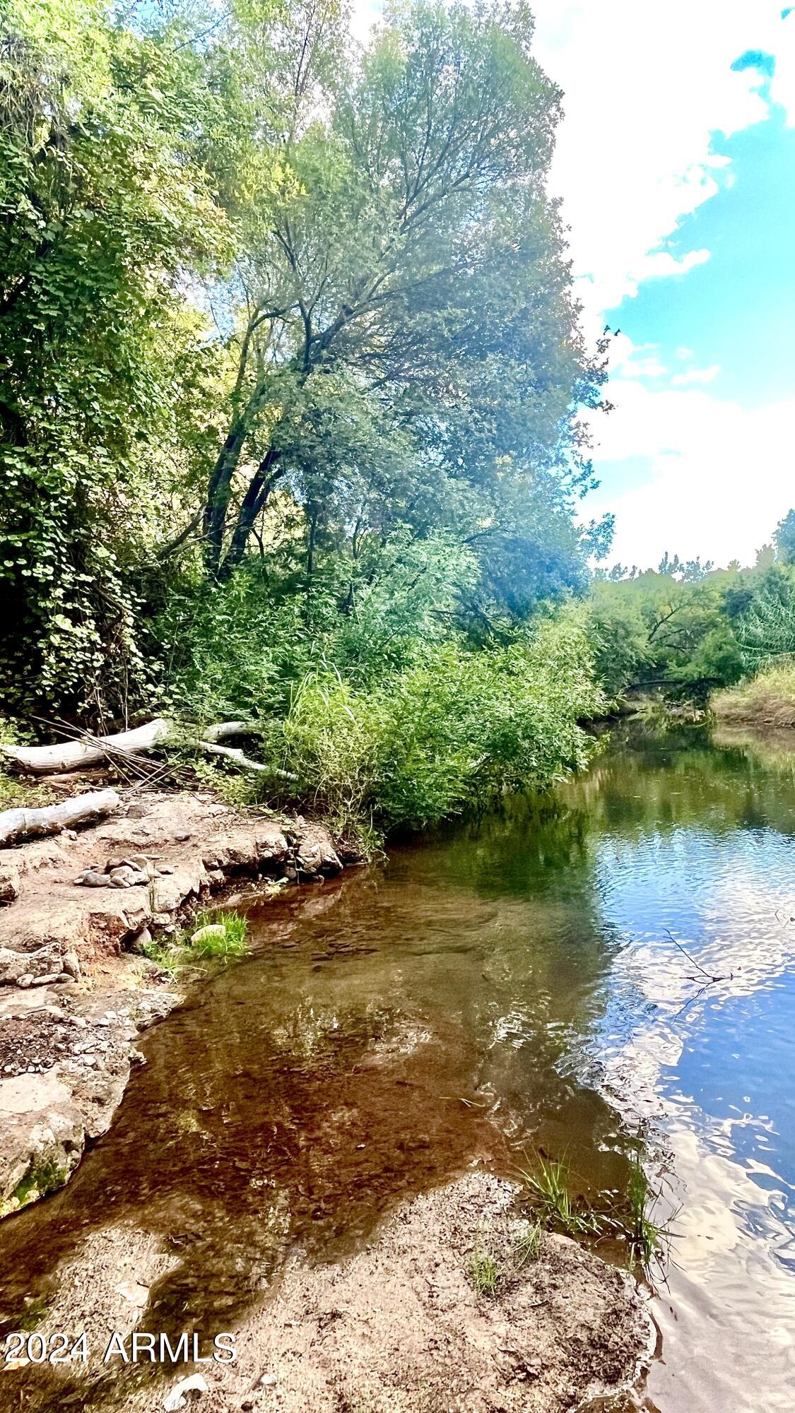 12-xx North Page Springs Road Cornville, AZ 86325 - Photo 4 of 11 a view of a lake with houses in the background