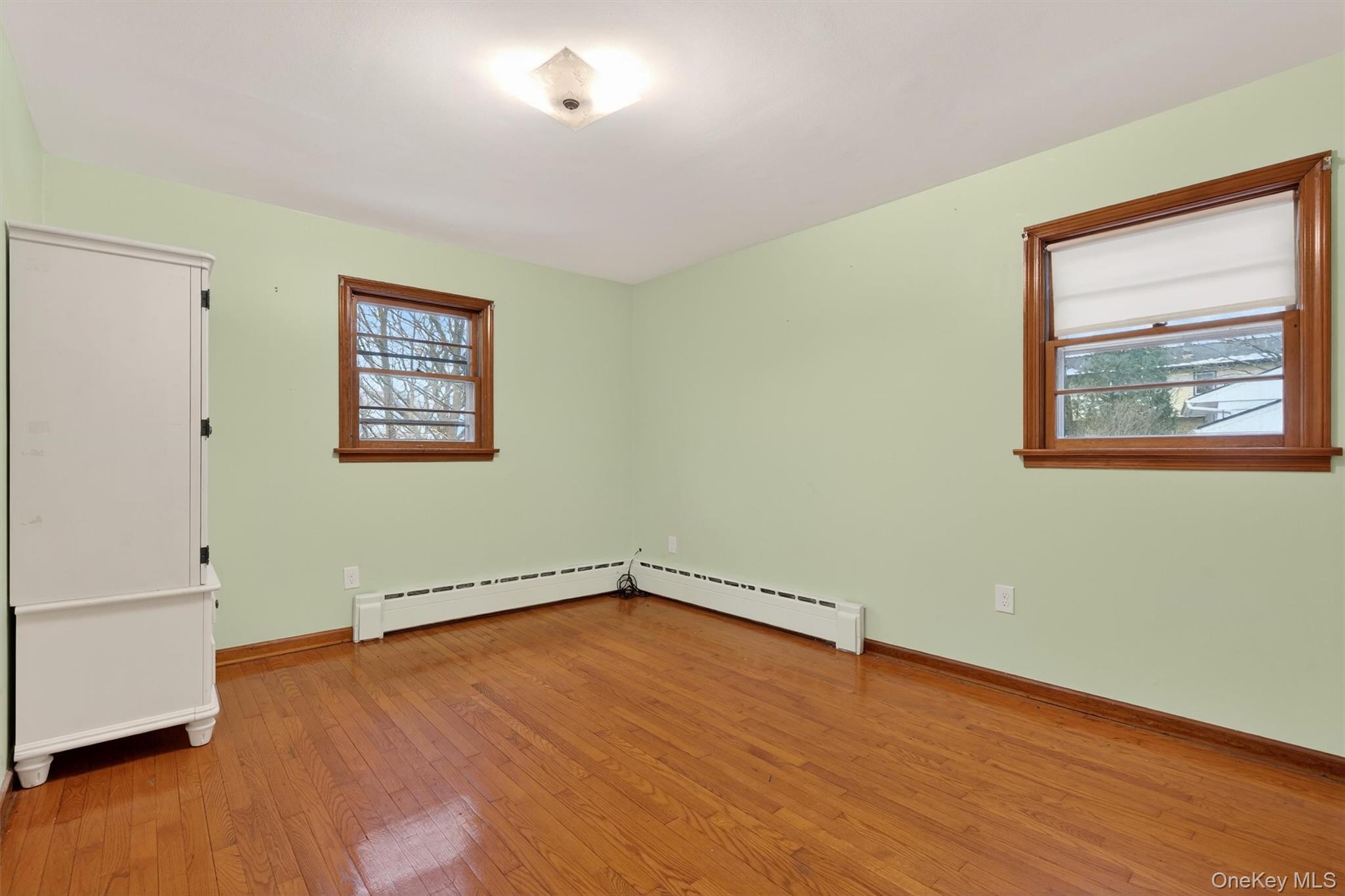 152 Old State Road Highland Falls, NY 10928 - Photo 24 of 38 an empty room with wooden floor and windows