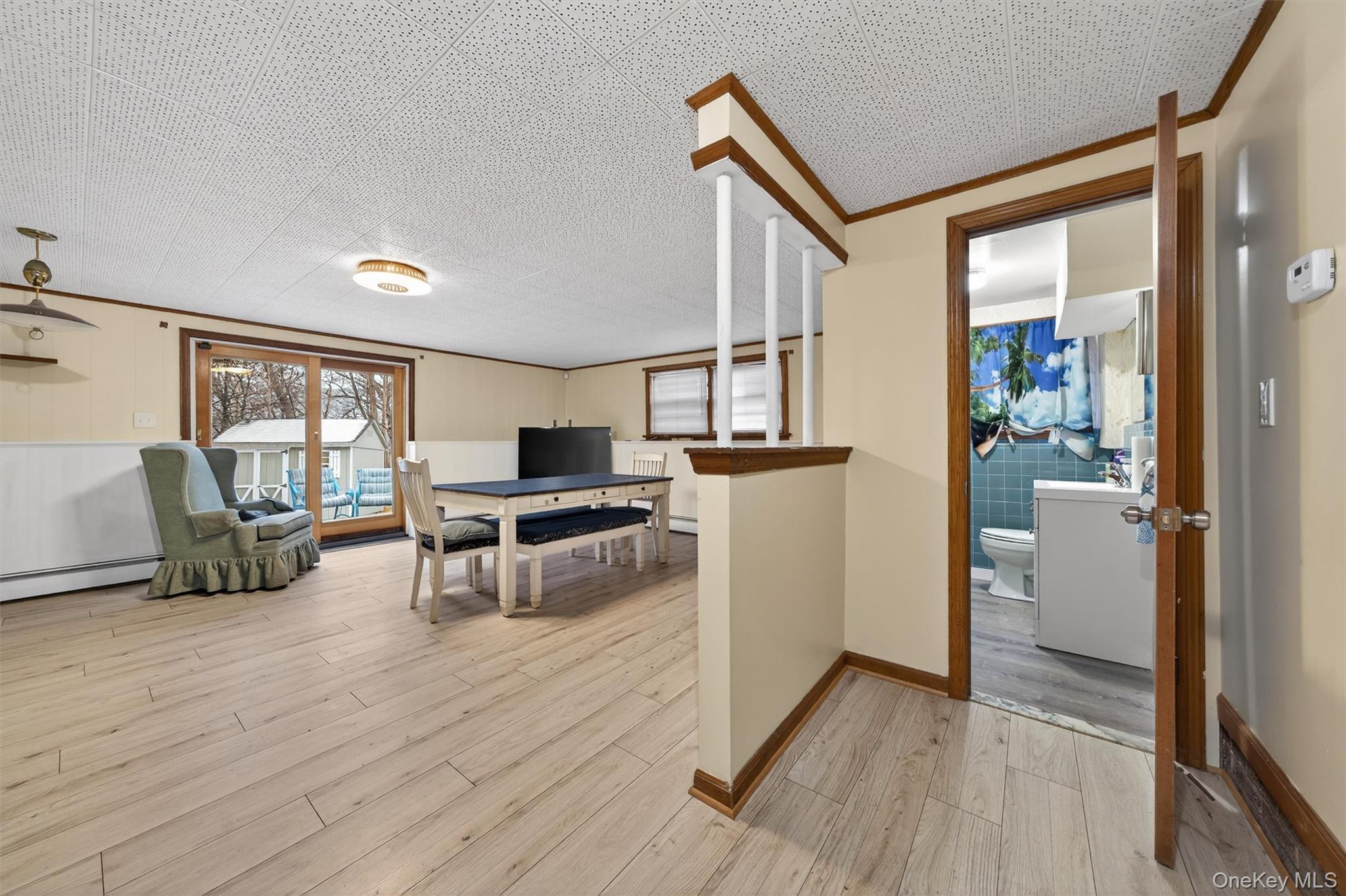 152 Old State Road Highland Falls, NY 10928 - Photo 28 of 38 a living room with furniture a flat screen tv and a floor to ceiling window