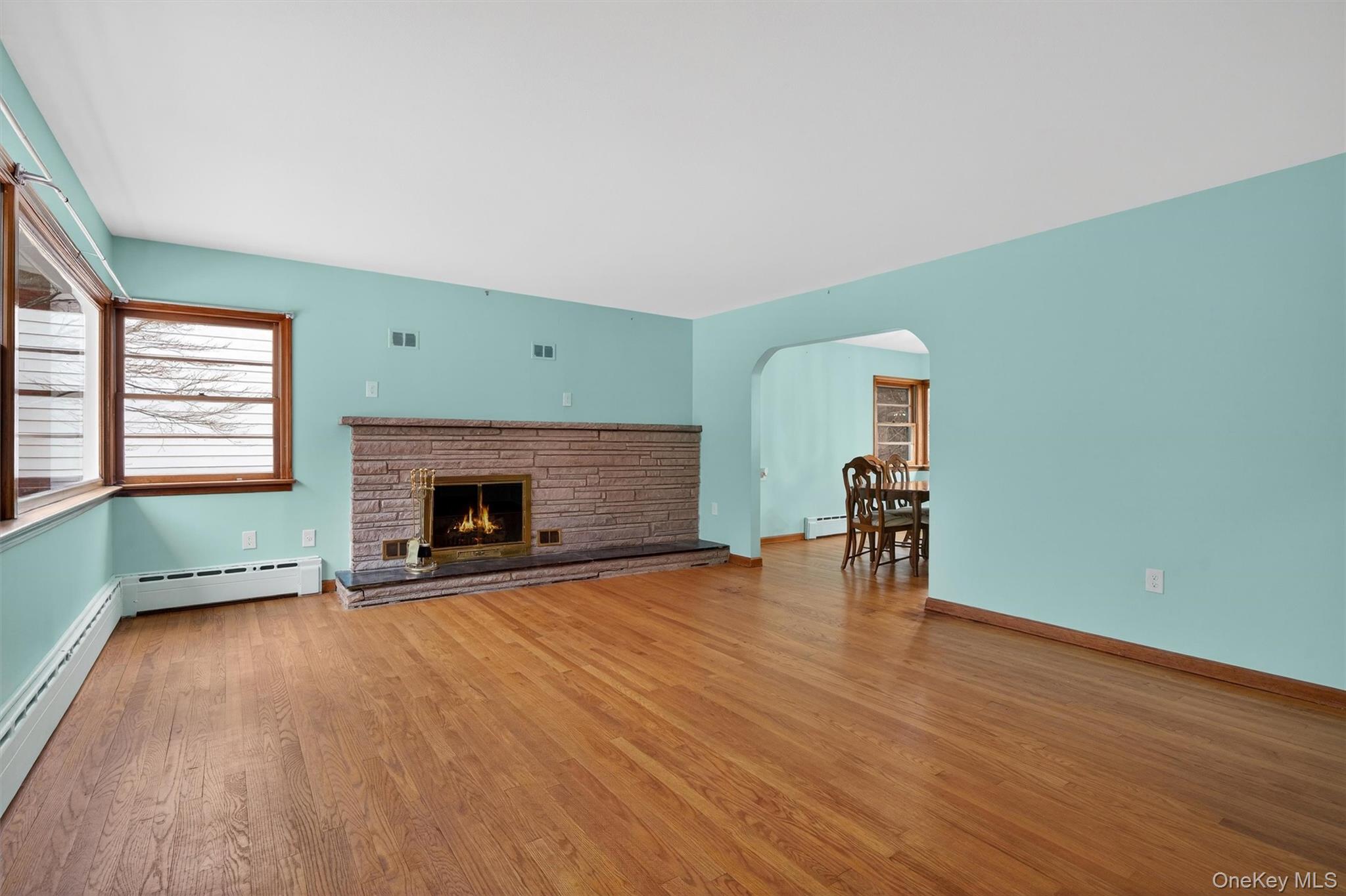 152 Old State Road Highland Falls, NY 10928 - Photo 9 of 38 a view of empty room with fireplace and wooden floor