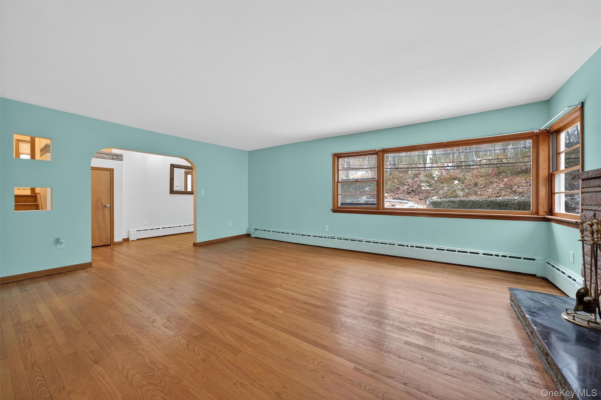 152 Old State Road Highland Falls, NY 10928 - Photo 10 of 38 an empty room with wooden floor and windows