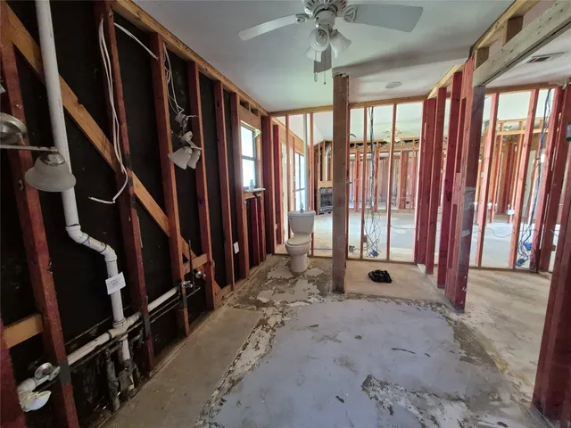 a view of an empty room with stairs