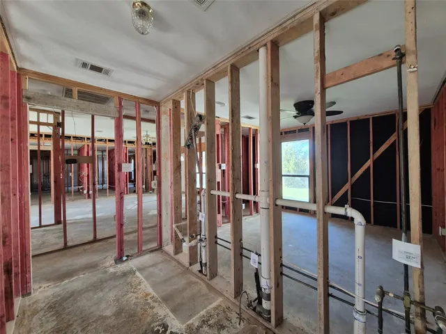 a view of entryway with stairs and windows