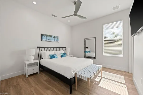 a bedroom with a bed and a window