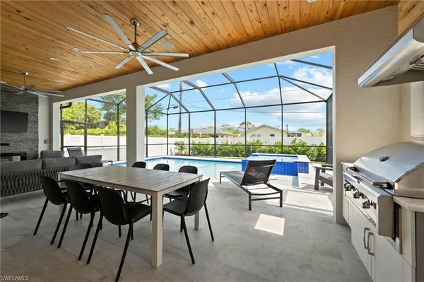a view of a dining room with furniture window and outside view
