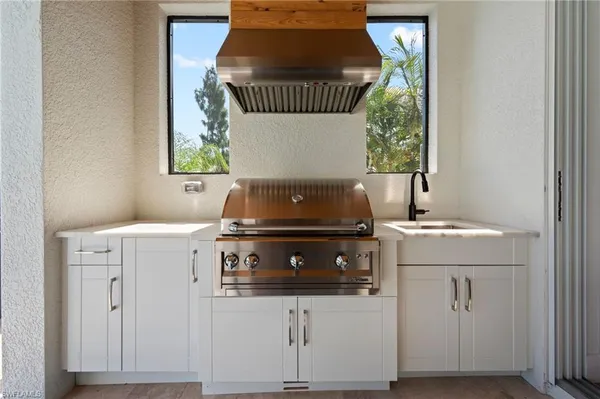 a kitchen with a stove and cabinets