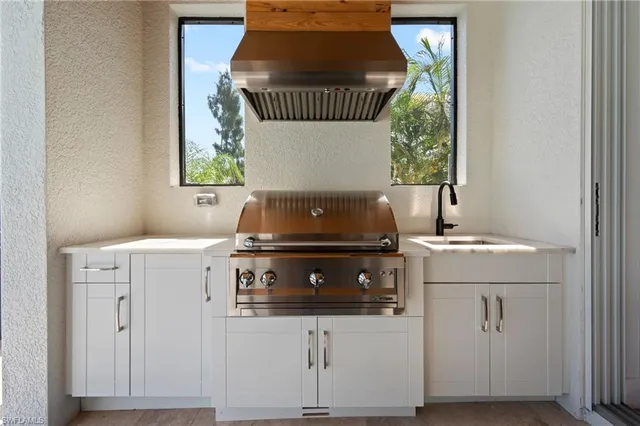 a kitchen with a stove and cabinets