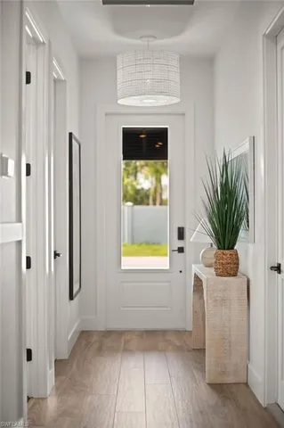 a view of an empty room with a fireplace and a window