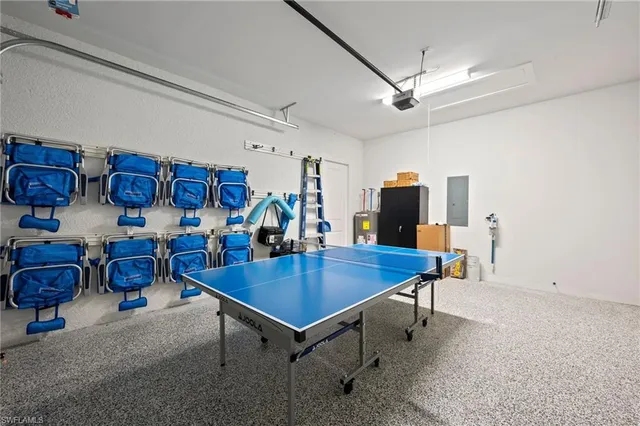 a dining room with furniture and a flat screen tv