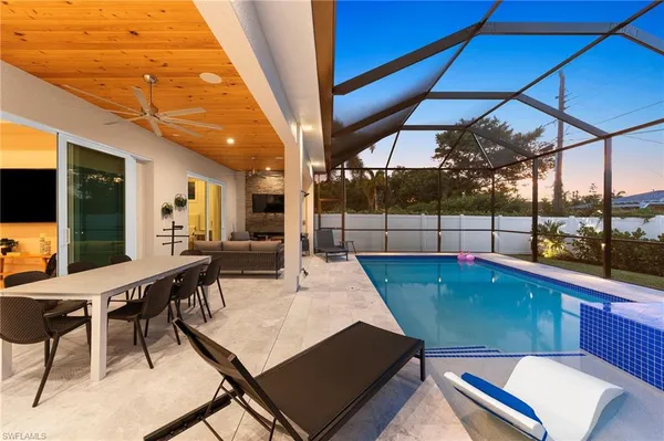 a patio with a table and chairs