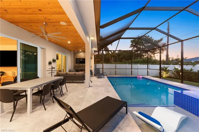 a patio with a table and chairs