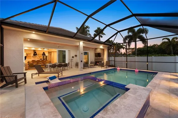a view of a swimming pool with a patio