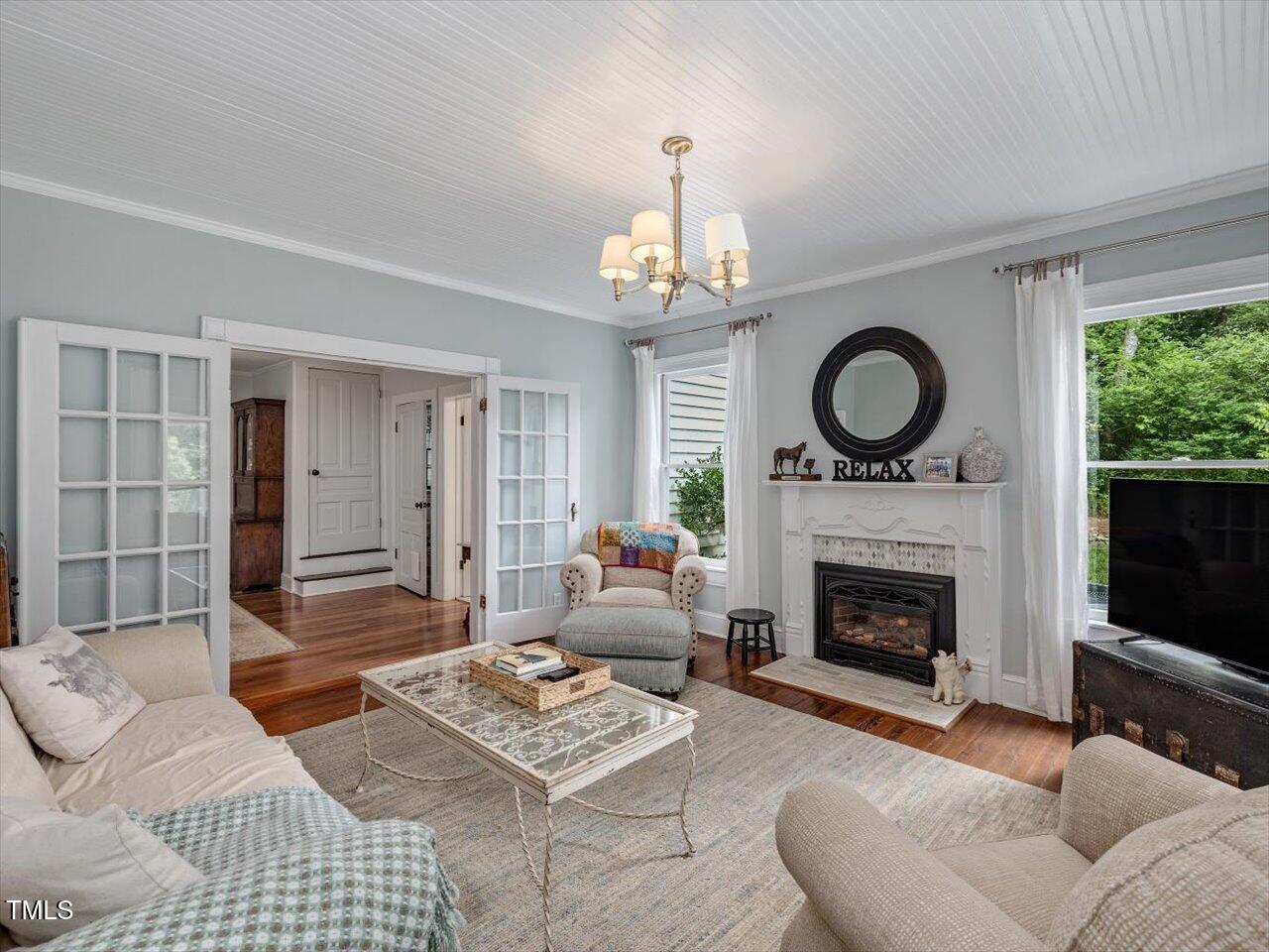 967 Bynum Road Pittsboro, NC 27312 - Photo 20 of 100 a living room with furniture a fireplace and a window