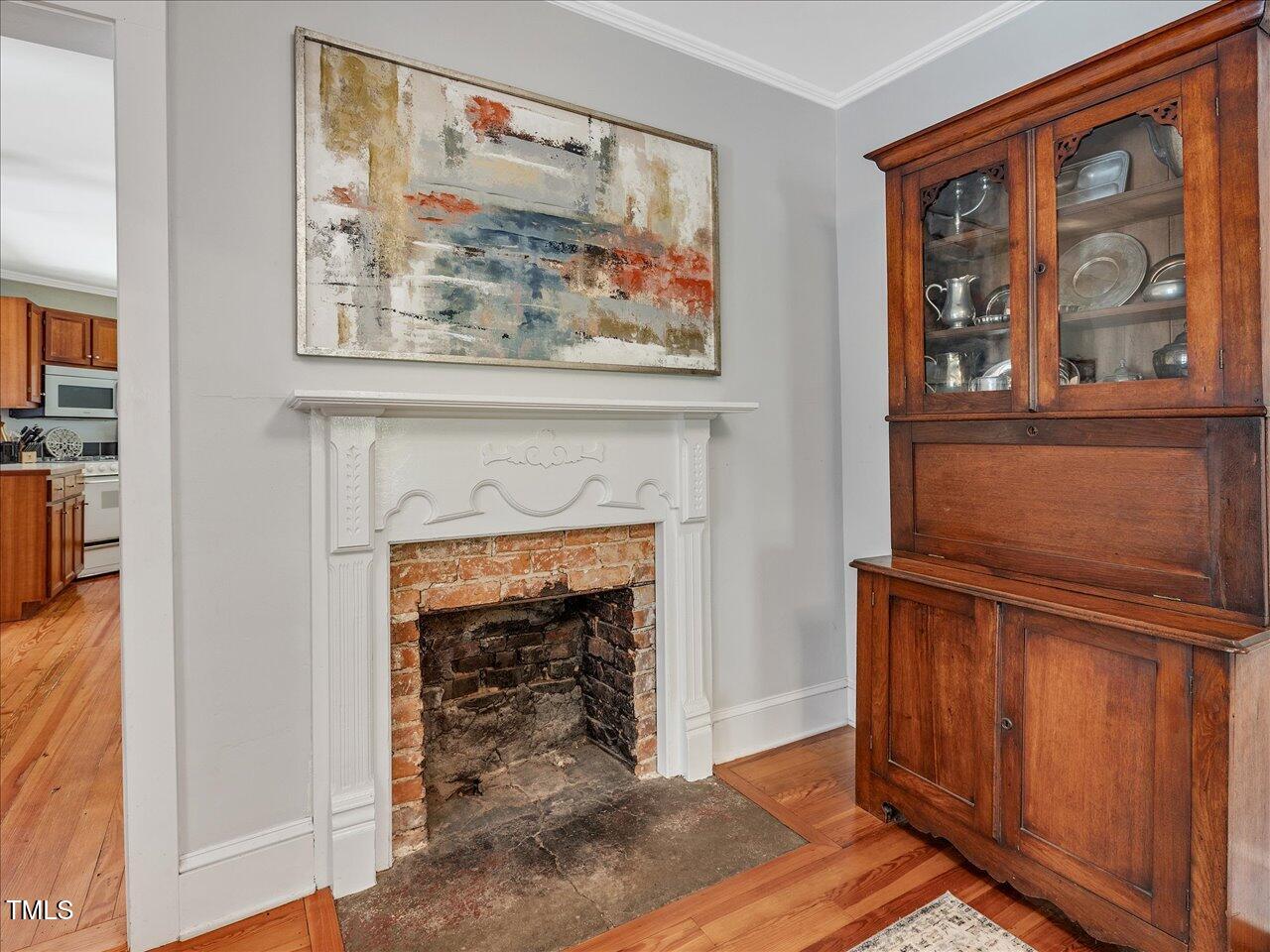 967 Bynum Road Pittsboro, NC 27312 - Photo 26 of 100 a view of a livingroom with a fireplace and a window