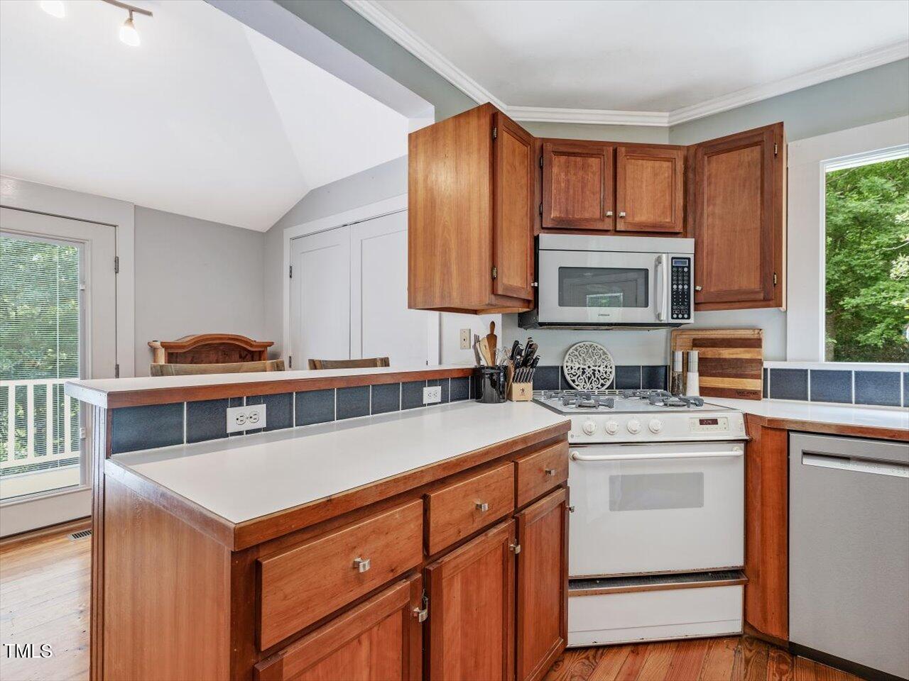 967 Bynum Road Pittsboro, NC 27312 - Photo 35 of 100 a kitchen that has a sink and a stove in it