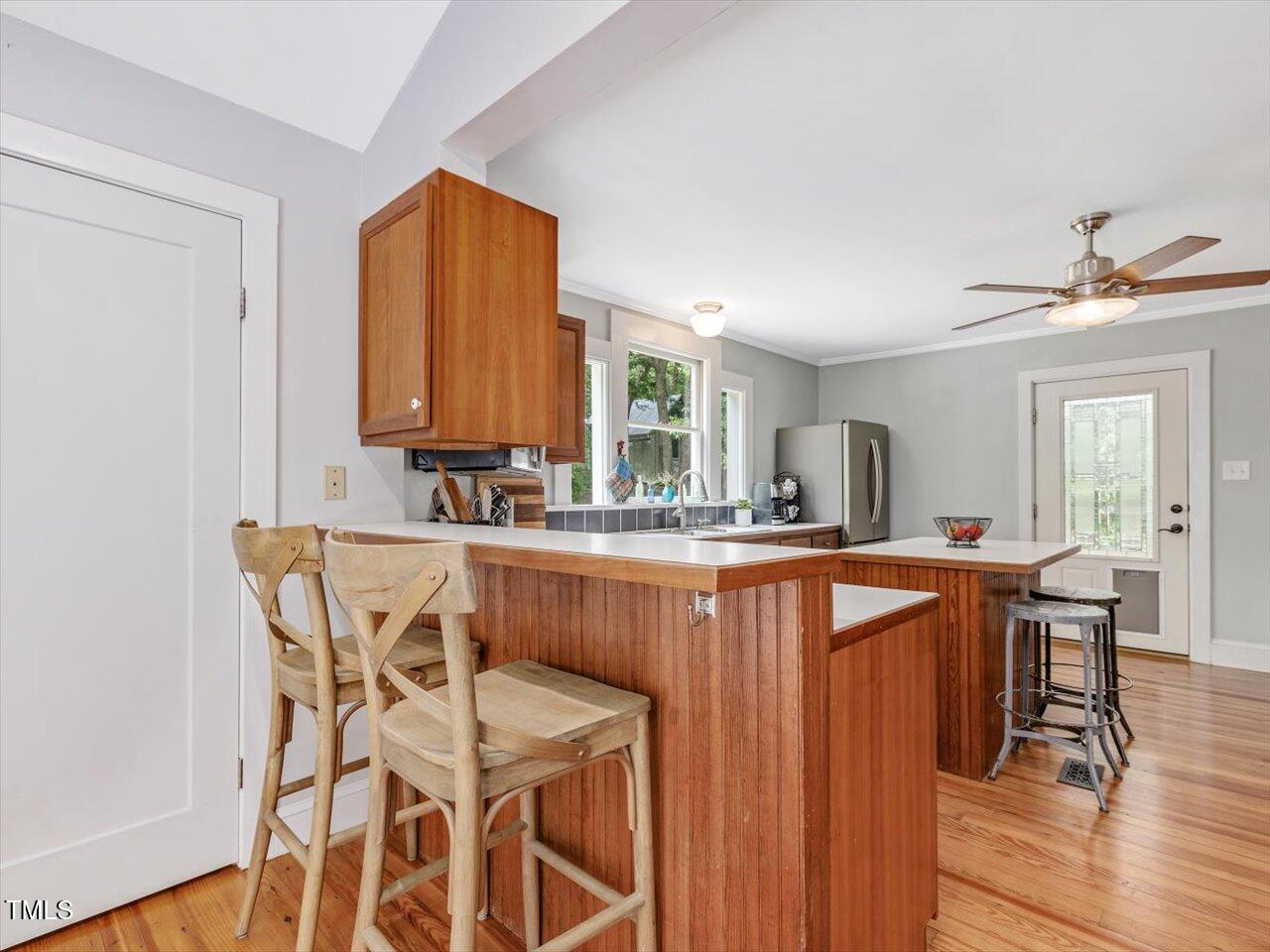 967 Bynum Road Pittsboro, NC 27312 - Photo 36 of 100 a view of a dining room with furniture and wooden floor