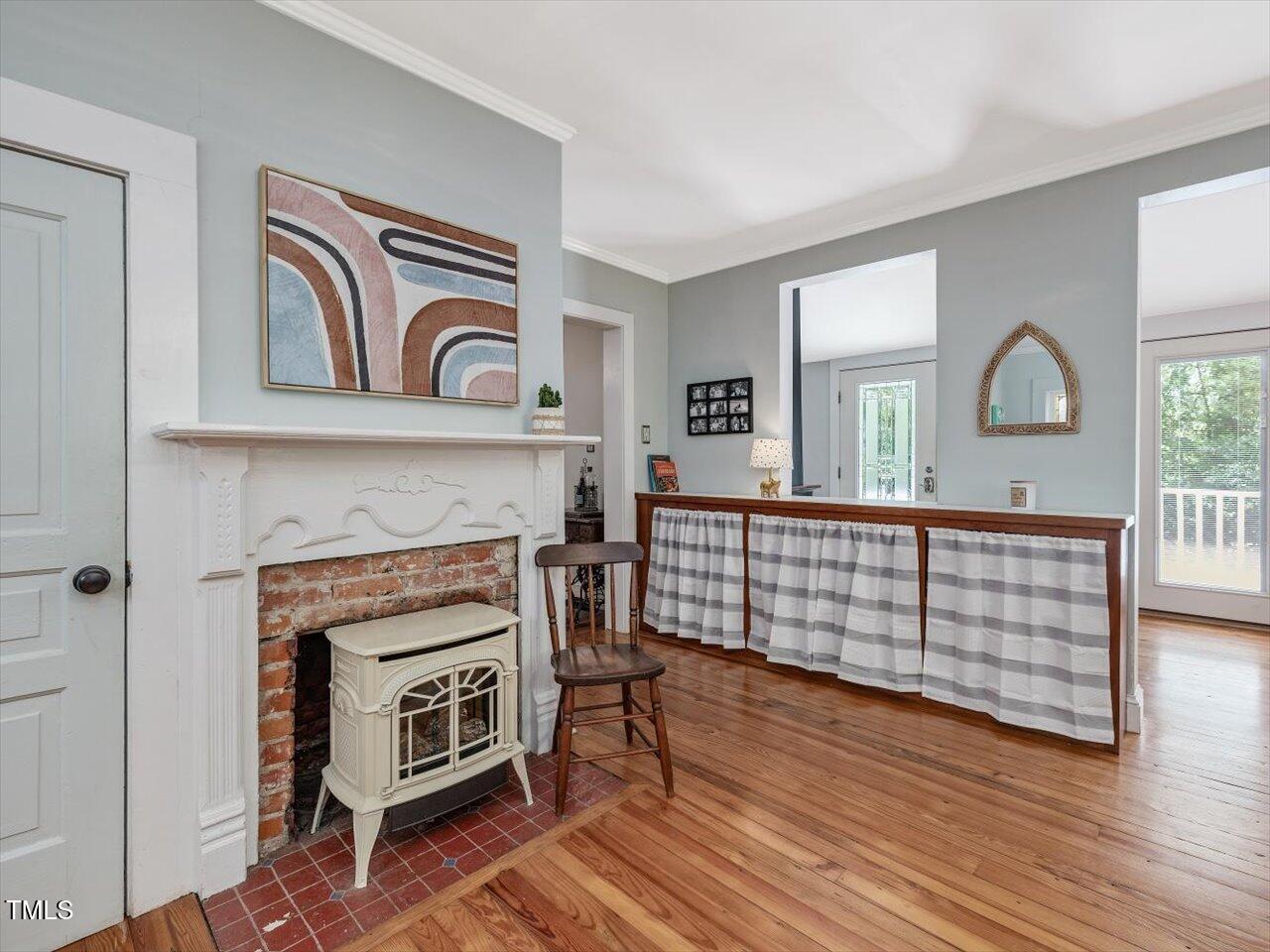 967 Bynum Road Pittsboro, NC 27312 - Photo 40 of 100 a bedroom with furniture and a fireplace