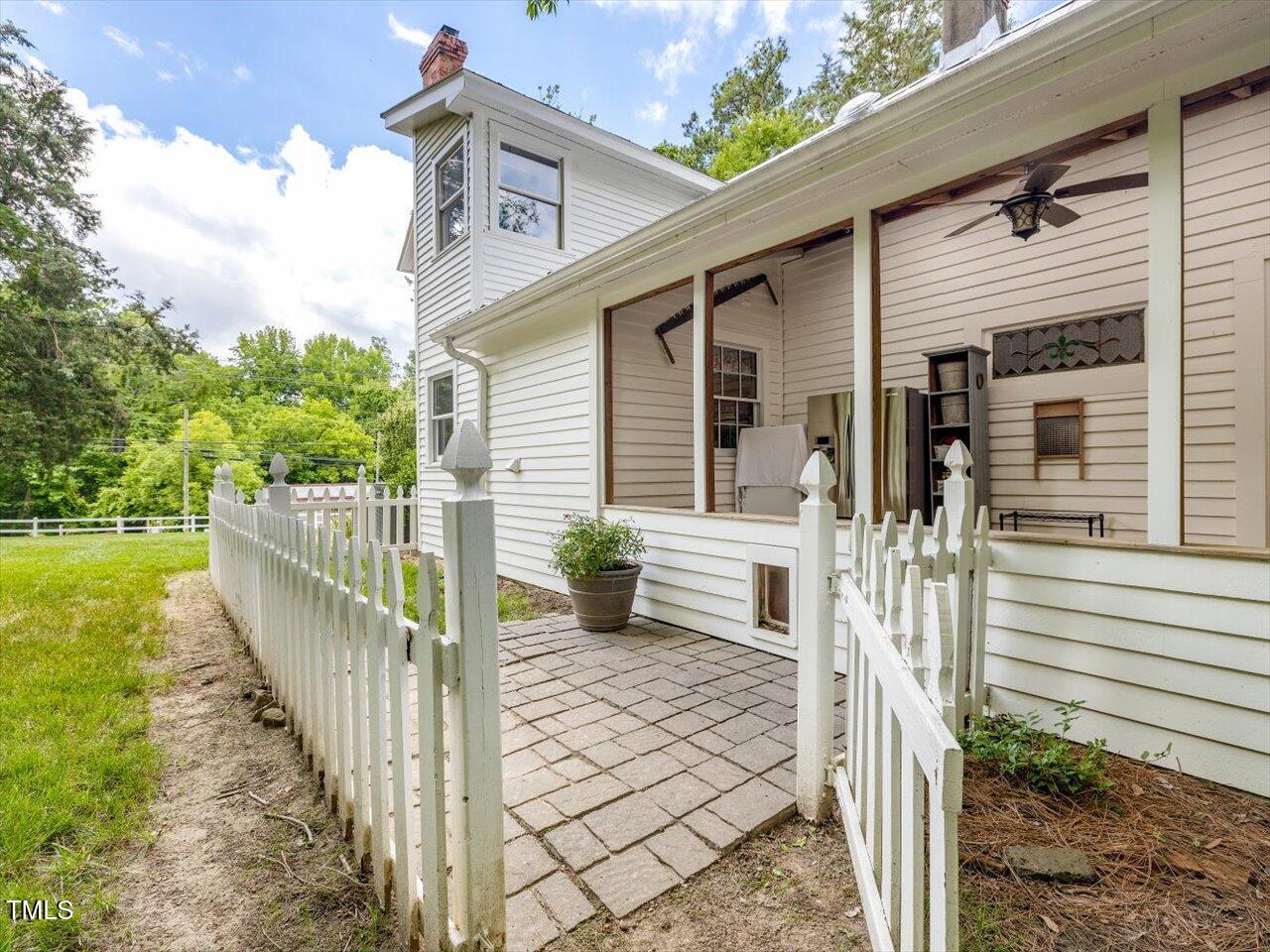 967 Bynum Road Pittsboro, NC 27312 - Photo 44 of 100 a view of a house with backyard and wooden fence