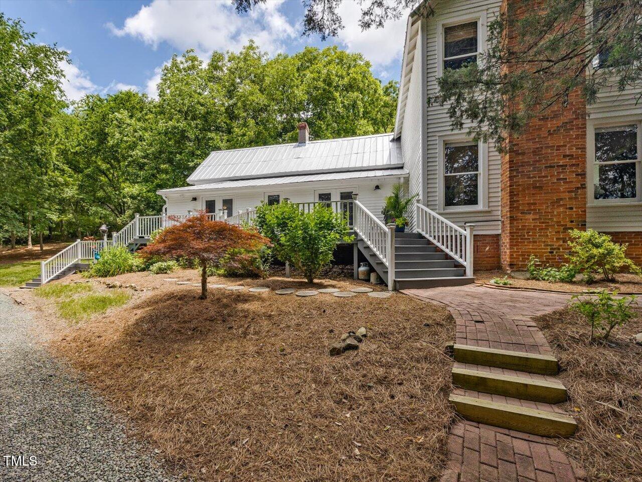 967 Bynum Road Pittsboro, NC 27312 - Photo 53 of 100 a view of a house with backyard and a tree