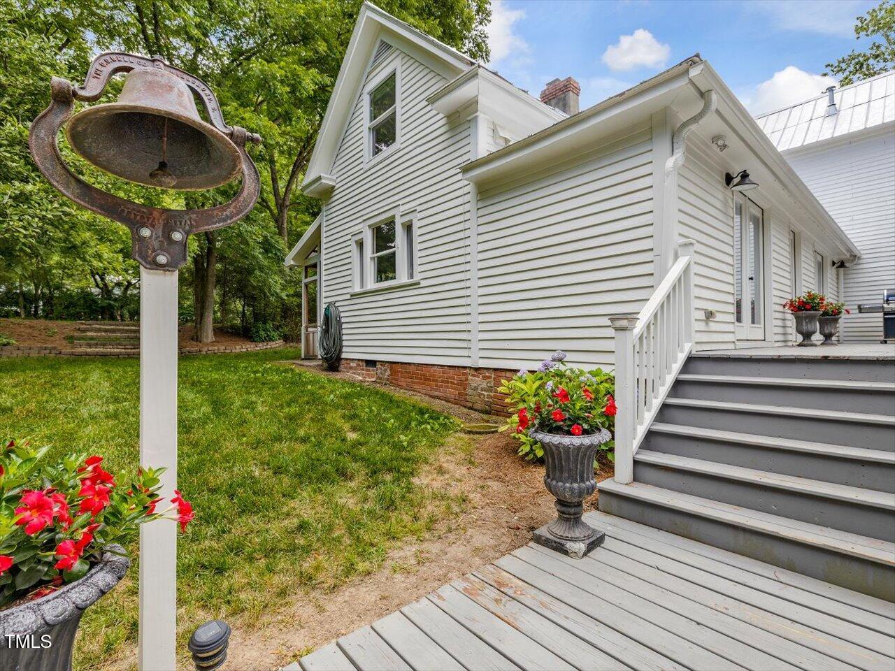 967 Bynum Road Pittsboro, NC 27312 - Photo 55 of 100 a front view of a house with a yard and a garden