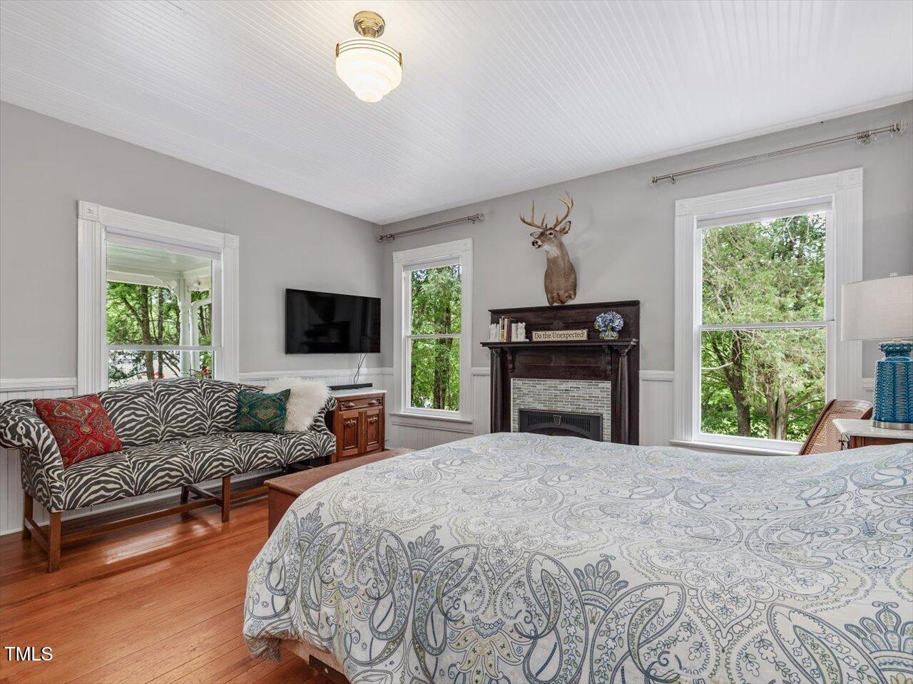 967 Bynum Road Pittsboro, NC 27312 - Photo 59 of 100 a spacious bedroom with a bed and a flat screen tv